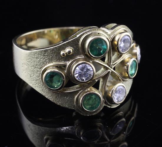 A Ray Smart (Guild of Sussex Craftsmen) modernist 18ct gold, diamond and emerald cocktail ring, size R.